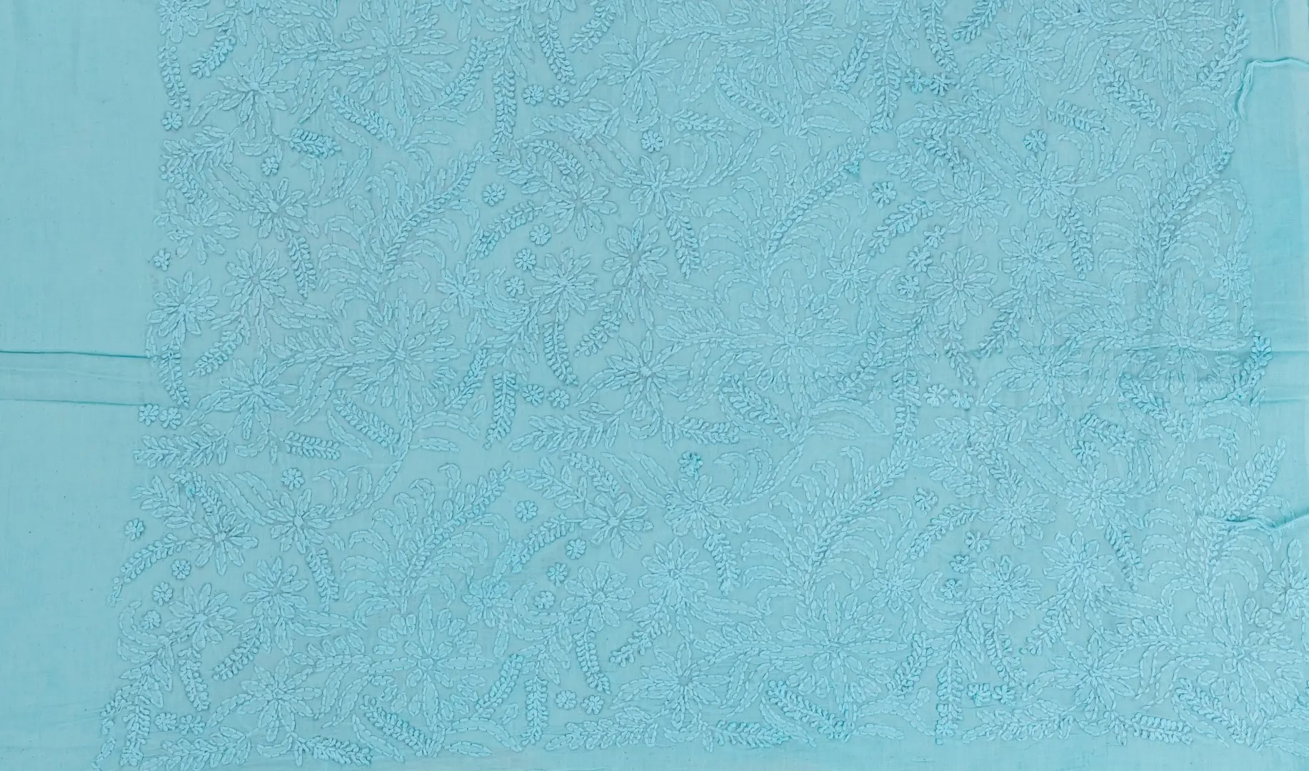 Adrika’s Turquoise Blue Cotton Kurta Set with Multicoloured Hand Embroidered Design